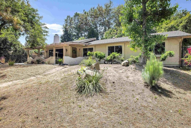 834 Cole Ranch Rd, Encinitas, CA 92024 - rear view of house featuring a chimney, a pergola, and stucco siding