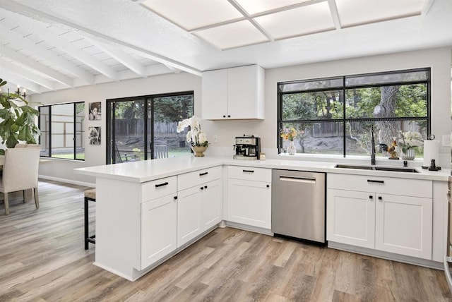 834 Cole Ranch Rd, Encinitas, CA 92024 - kitchen featuring dishwasher, a peninsula, beam ceiling, light countertops, and white cabinetry