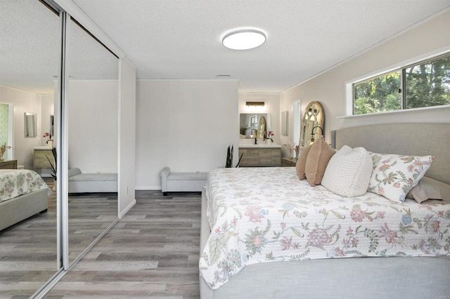 834 Cole Ranch Rd, Encinitas, CA 92024 - bedroom featuring wood finished floors, connected bathroom, and a closet