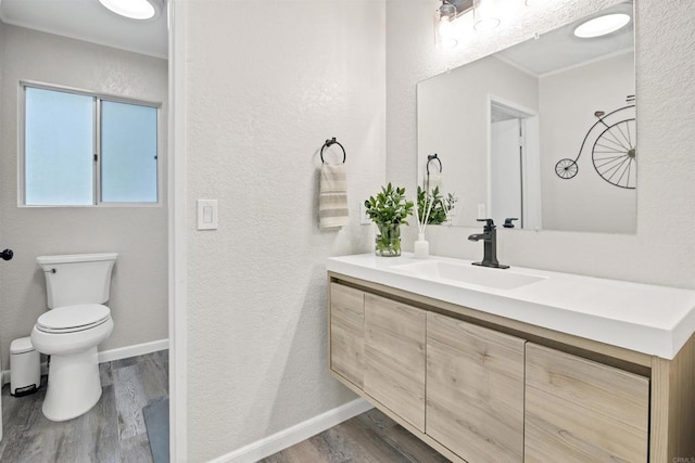 834 Cole Ranch Rd, Encinitas, CA 92024 - bathroom with a textured wall, wood finished floors, vanity, and ornamental molding