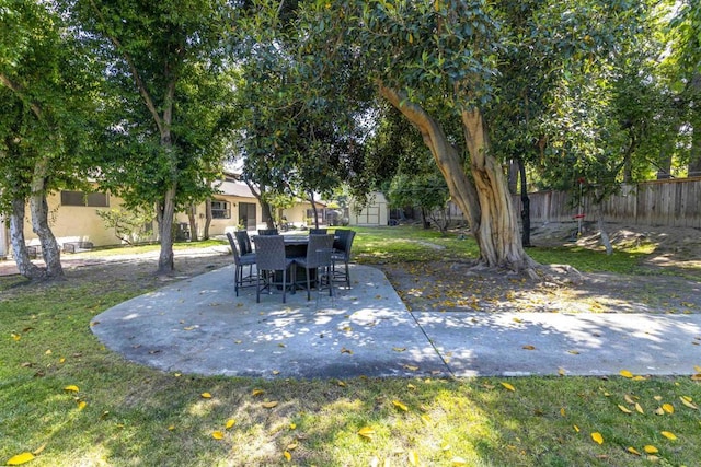 834 Cole Ranch Rd, Encinitas, CA 92024 - fenced backyard featuring a patio, a shed, and outdoor dining space