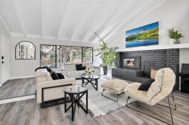 834 Cole Ranch Rd, Encinitas, CA 92024 - living area with a brick fireplace, wood finished floors, and wooden ceiling