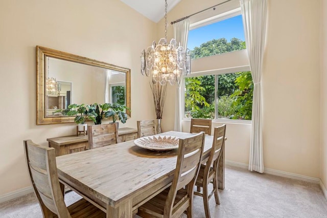 3551 Starboard Cir, Oceanside, CA 92054 - dining space featuring a chandelier, light carpet, and vaulted ceiling
