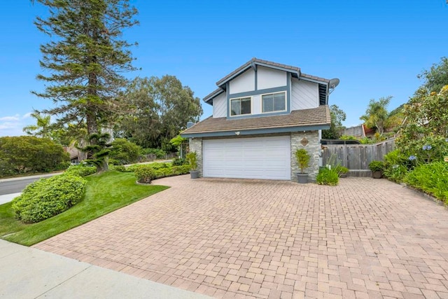 3551 Starboard Cir, Oceanside, CA 92054 - view of front of property with decorative driveway, stone siding, a garage, and a tile roof
