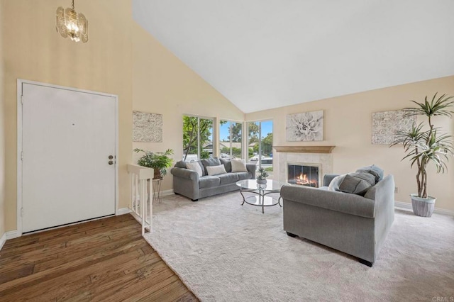 3551 Starboard Cir, Oceanside, CA 92054 - living room featuring high vaulted ceiling, wood finished floors, and a glass covered fireplace