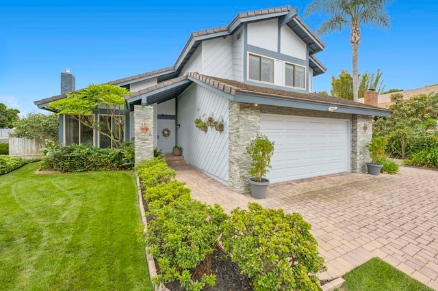 3551 Starboard Cir, Oceanside, CA 92054 - view of front of home with a garage, a front lawn, decorative driveway, a chimney, and stone siding