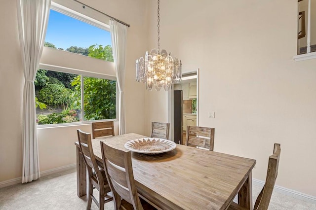 3551 Starboard Cir, Oceanside, CA 92054 - dining space featuring light carpet, a chandelier, and a towering ceiling