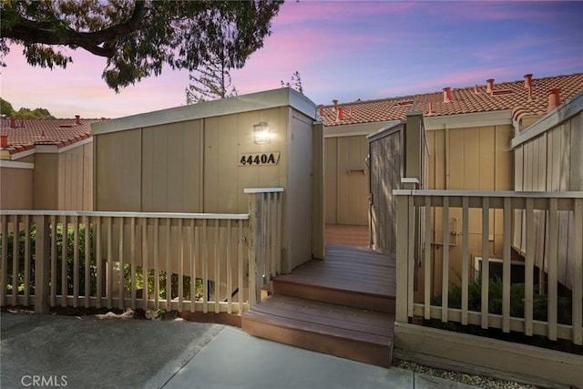 4440 Eagle Peak Rd Unit A, Concord, CA 94521 - exterior entry at dusk featuring a tile roof