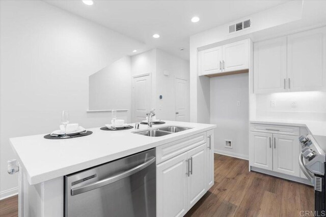 320 El Cajon Blvd, El Cajon, CA 92020 - kitchen featuring appliances with stainless steel finishes, white cabinets, light countertops, a kitchen island with sink, and recessed lighting