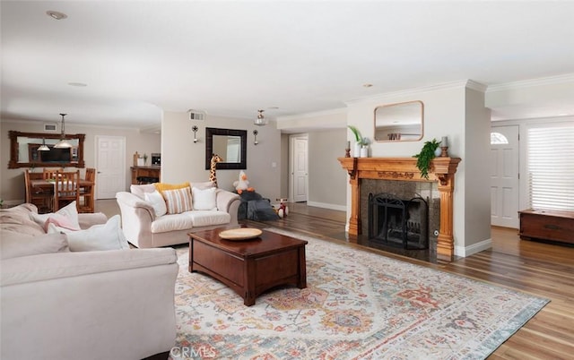 18921 Silver Maple Way N, Tustin, CA 92705 - living area featuring ornamental molding, light wood-type flooring, and a fireplace