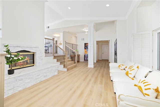 15429 Turquoise Cir N, Chino Hills, CA 91709 - living area with a fireplace, stairway, ornate columns, light wood-style flooring, and recessed lighting