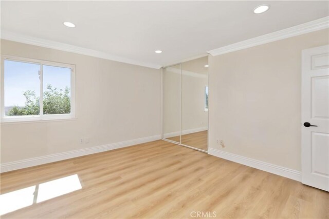 15429 Turquoise Cir N, Chino Hills, CA 91709 - unfurnished bedroom with ornamental molding, recessed lighting, light wood-style flooring, and a closet