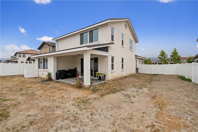 421 Azalea St, Fillmore, CA 93015 - rear view of house with stucco siding, a patio area, and a fenced backyard