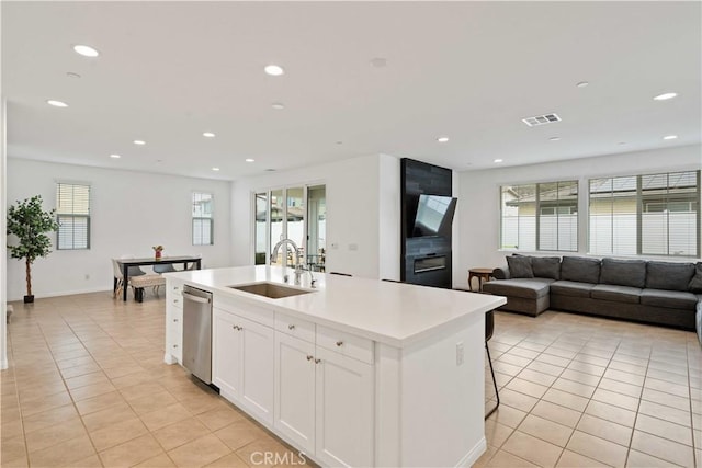 421 Azalea St, Fillmore, CA 93015 - kitchen featuring dishwasher, light tile patterned floors, white cabinets, recessed lighting, and a kitchen island with sink