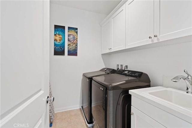 421 Azalea St, Fillmore, CA 93015 - laundry room with washing machine and dryer, cabinet space, and light tile patterned floors