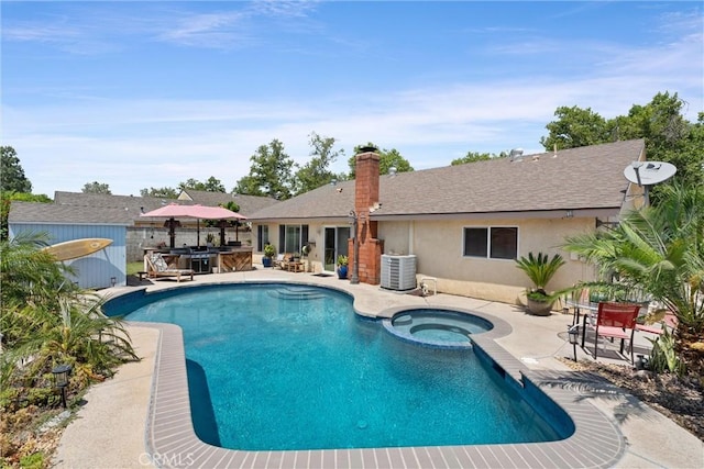 11116 Wayfield Rd, Riverside, CA 92505 - view of pool featuring a patio area, a pool with connected hot tub, and an outbuilding