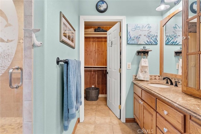 11116 Wayfield Rd, Riverside, CA 92505 - bathroom with a stall shower, vanity, tile patterned flooring, and decorative backsplash