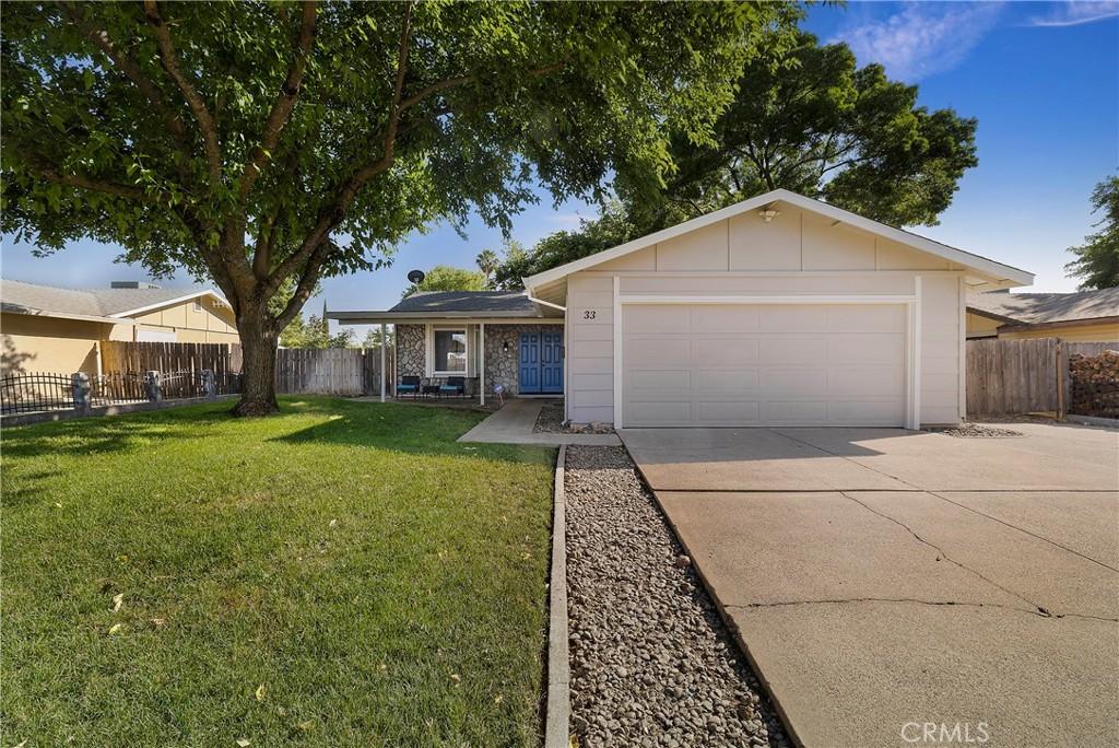 33 Parkhurst St, Chico, CA 95928 - ranch-style home with driveway and an attached garage