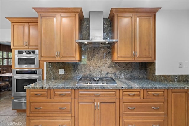 10868 Willowcrest Pl, Studio City, CA 91604 - kitchen with wall chimney range hood, a warming drawer, stainless steel gas cooktop, and decorative backsplash