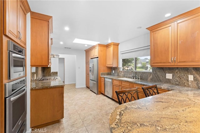 10868 Willowcrest Pl, Studio City, CA 91604 - kitchen with stainless steel appliances, dark stone counters, recessed lighting, decorative backsplash, and light tile patterned floors