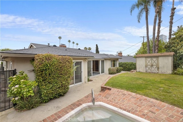 10868 Willowcrest Pl, Studio City, CA 91604 - back of property with a patio, a yard, a shed, stucco siding, and a chimney