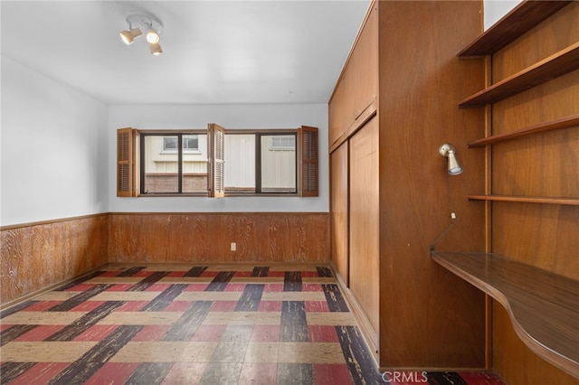10868 Willowcrest Pl, Studio City, CA 91604 - unfurnished bedroom featuring a closet, wainscoting, and wood walls