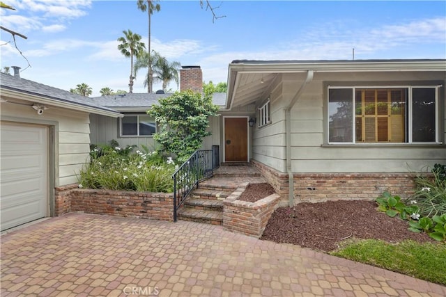 10868 Willowcrest Pl, Studio City, CA 91604 - property entrance with a chimney and a garage