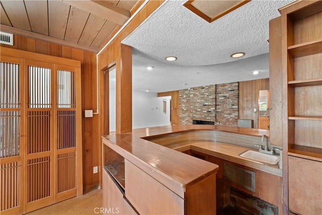 10868 Willowcrest Pl, Studio City, CA 91604 - bar with wood walls, a textured ceiling, recessed lighting, and a brick fireplace