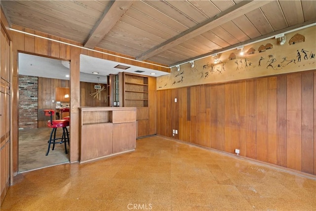 10868 Willowcrest Pl, Studio City, CA 91604 - unfurnished living room featuring wooden walls, tile patterned floors, a wooden ceiling with exposed beams, and bar
