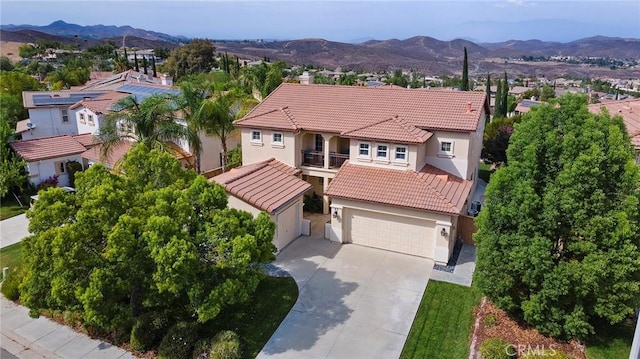 25 Vista Palermo, Lake Elsinore, CA 92532 - mediterranean / spanish-style home featuring a tile roof, stucco siding, and a mountain view