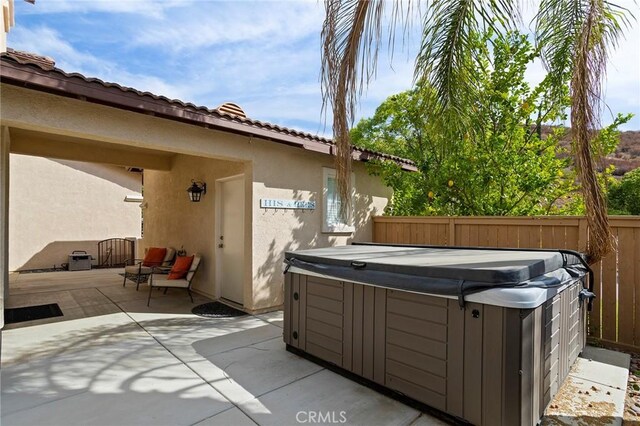 25 Vista Palermo, Lake Elsinore, CA 92532 - view of patio / terrace with a hot tub