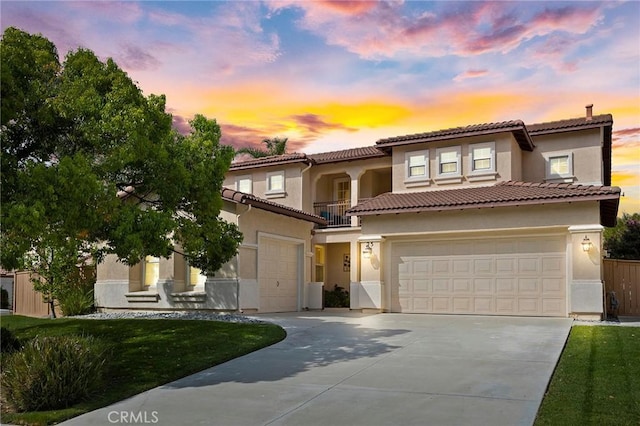 25 Vista Palermo, Lake Elsinore, CA 92532 - mediterranean / spanish home featuring concrete driveway, a balcony, stucco siding, a garage, and a tile roof