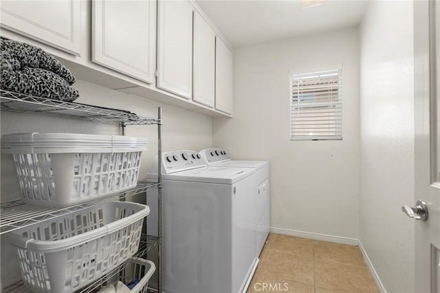 25 Vista Palermo, Lake Elsinore, CA 92532 - laundry area featuring washing machine and dryer, light tile patterned flooring, and cabinet space