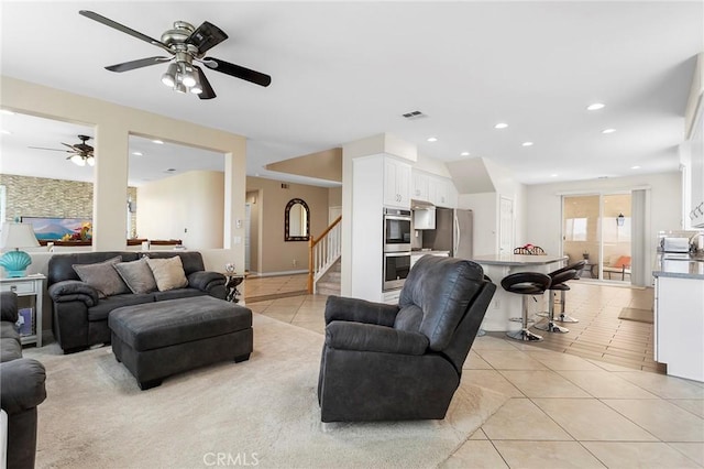 25 Vista Palermo, Lake Elsinore, CA 92532 - living area featuring light tile patterned flooring, ceiling fan, stairway, and recessed lighting