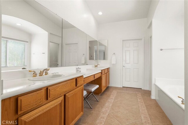 25 Vista Palermo, Lake Elsinore, CA 92532 - bathroom featuring double vanity, a garden tub, tile patterned floors, and recessed lighting