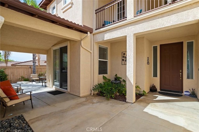 25 Vista Palermo, Lake Elsinore, CA 92532 - view of exterior entry featuring stucco siding and a patio