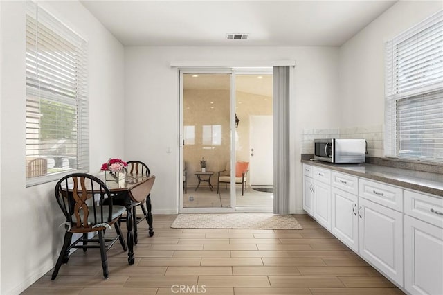25 Vista Palermo, Lake Elsinore, CA 92532 - dining space featuring wood tiled floors and baseboards