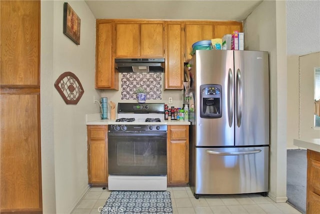 10395 Shahaptain Ave, Hesperia, CA 92345 - kitchen featuring stainless steel refrigerator with ice dispenser, ventilation hood, gas range gas stove, and brown cabinets