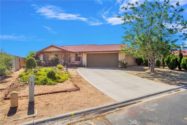 10395 Shahaptain Ave, Hesperia, CA 92345 - single story home featuring a tile roof, a garage, concrete driveway, and stucco siding