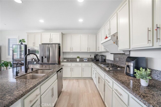 16138 Solitude Ave, Chino, CA 91708 - kitchen featuring stainless steel appliances, white cabinets, recessed lighting, light wood-style flooring, and dark stone counters