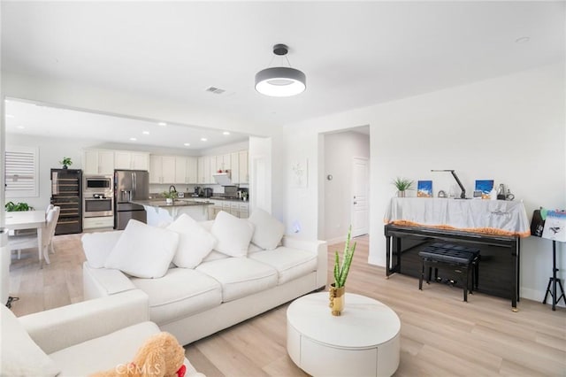 16138 Solitude Ave, Chino, CA 91708 - living room with light wood-style flooring and recessed lighting