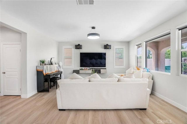 16138 Solitude Ave, Chino, CA 91708 - living room featuring baseboards and light wood-style floors
