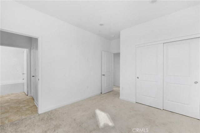 94191/2 N Sepulveda Blvd Unit 1, North Hills, CA 91343 - unfurnished bedroom featuring carpet floors and a closet