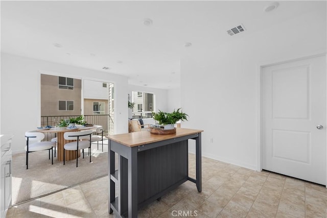 94191/2 N Sepulveda Blvd Unit 1, North Hills, CA 91343 - kitchen featuring baseboards and wood counters