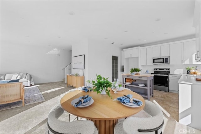 94191/2 N Sepulveda Blvd Unit 1, North Hills, CA 91343 - dining space featuring stairway