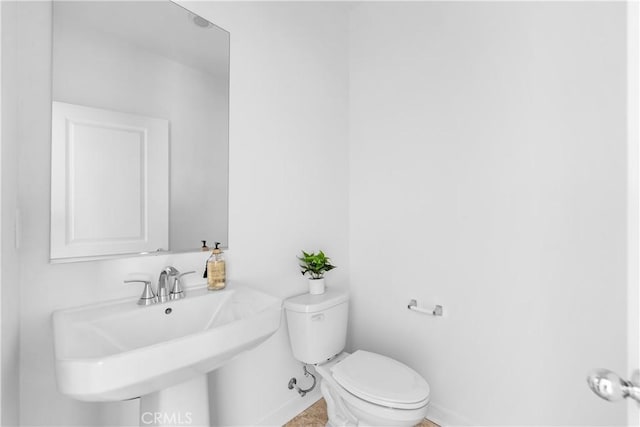 94191/2 N Sepulveda Blvd Unit 1, North Hills, CA 91343 - half bath featuring toilet and baseboards