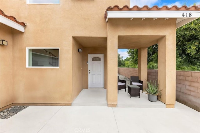 418 N Dalton Ave, Azusa, CA 91702 - doorway to property featuring stucco siding and a patio