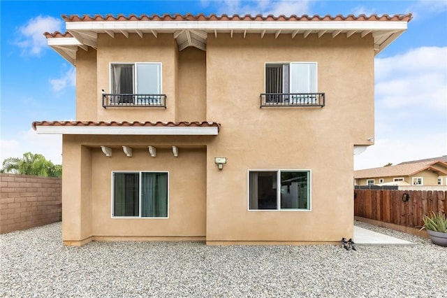 418 N Dalton Ave, Azusa, CA 91702 - back of house with stucco siding, a fenced backyard, a balcony, and a patio area