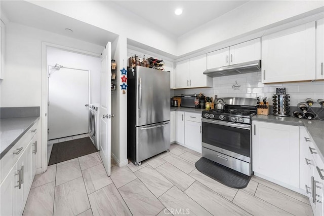 418 N Dalton Ave, Azusa, CA 91702 - kitchen featuring stainless steel appliances, under cabinet range hood, white cabinets, tasteful backsplash, and washer / clothes dryer
