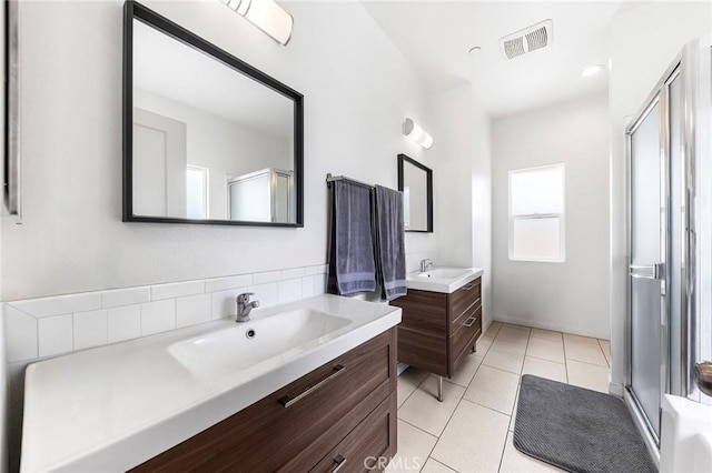 418 N Dalton Ave, Azusa, CA 91702 - bathroom with a shower stall, two vanities, and tile patterned floors